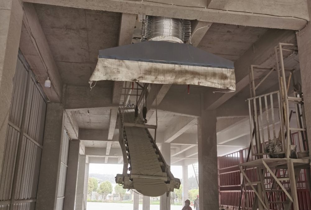 Dust removal device for bagged cement loader 1